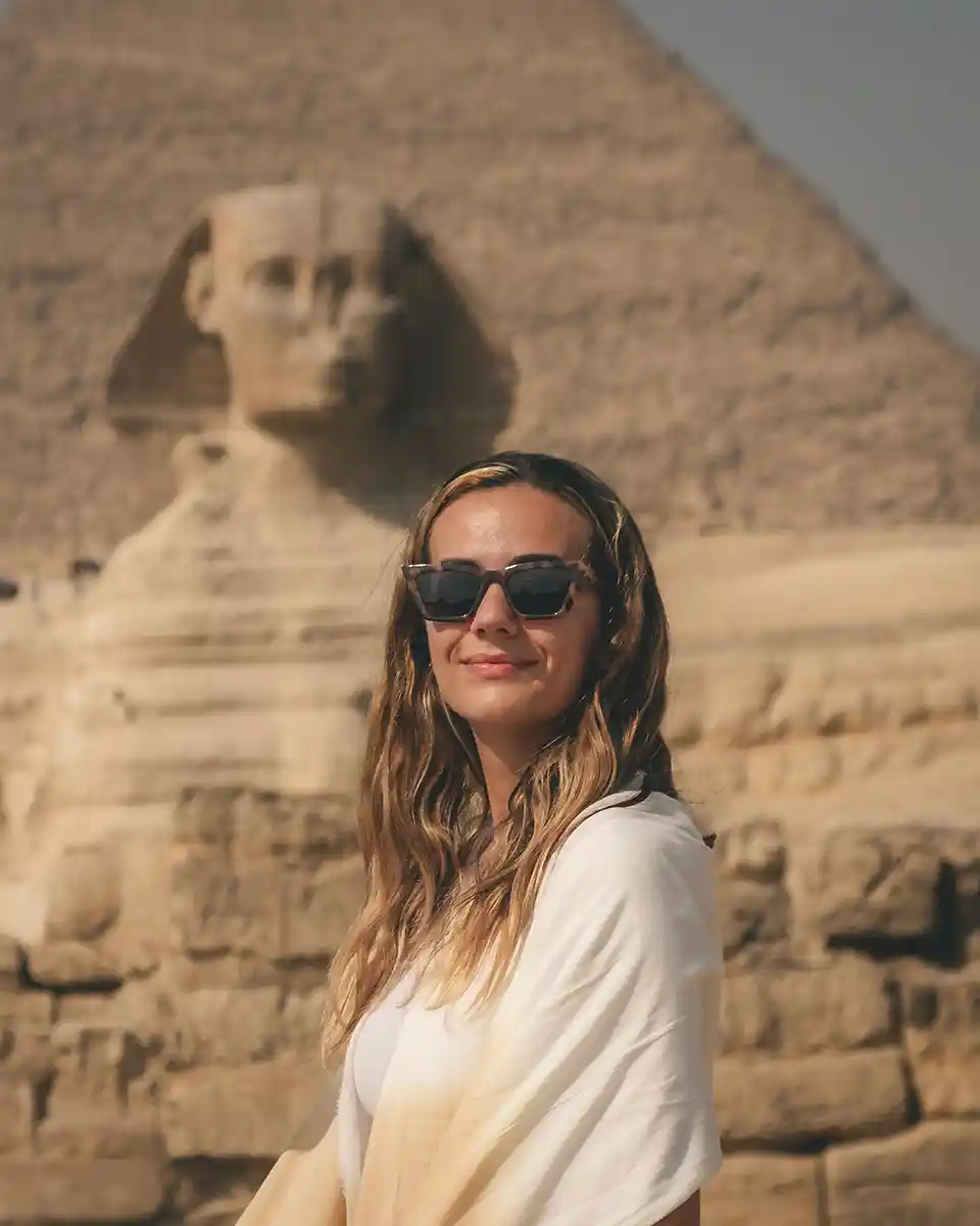 about-me Lucy smiling at the camera with the Great Sphinx in the background.